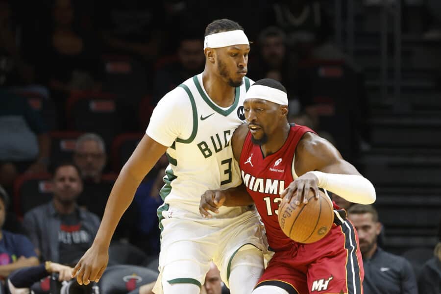 Nov 26, 2025; Miami, Florida, USA; Milwaukee Bucks center Myles Turner (3) defends Miami Heat center Bam Adebayo (13) during the first half of an NBA Cup game at Kaseya Center. Mandatory Credit: Rhona Wise-Imagn Images